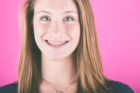 Smiling girl wearing braces
