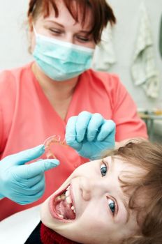 Tween getting fitted with a retainer in Phase I treatment