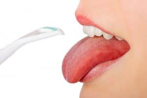 using a tongue cleaner for braces