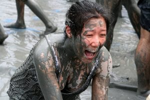 Girl with braces in Tough Mudder race