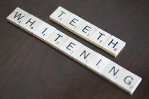 teeth whitening written in scrabble tiles