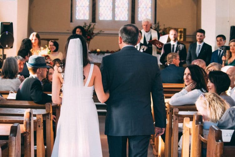 Bride and Man in Suit Walking Down Aisle
