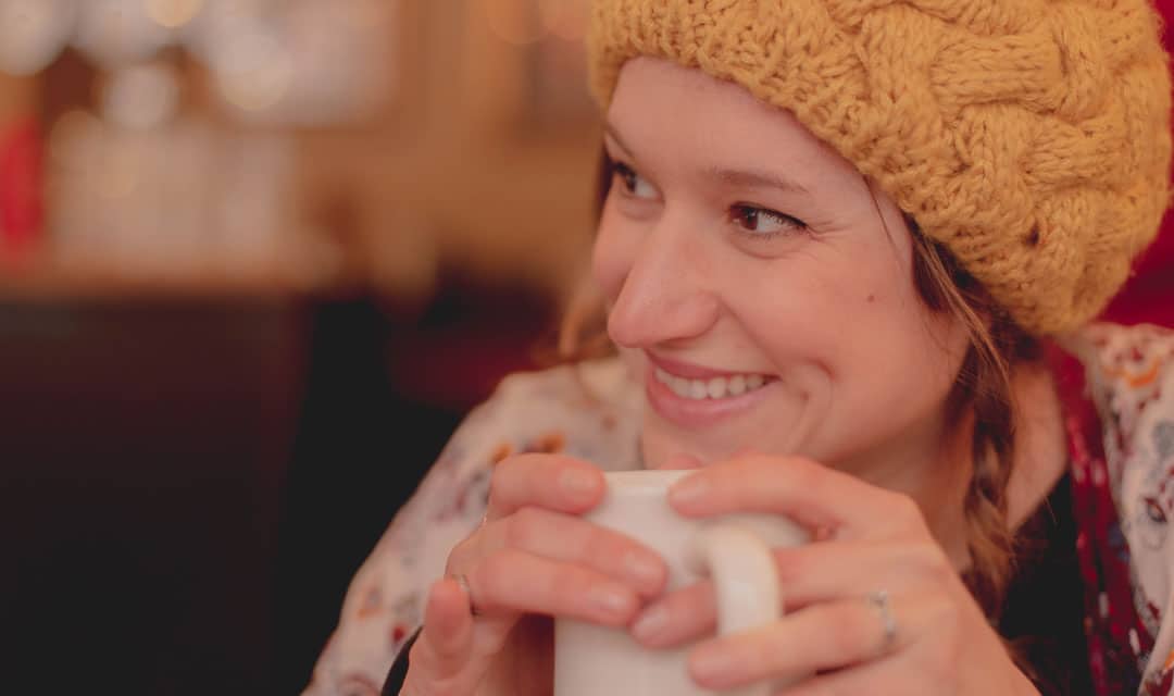 Woman Smiling with Cup of Coffee