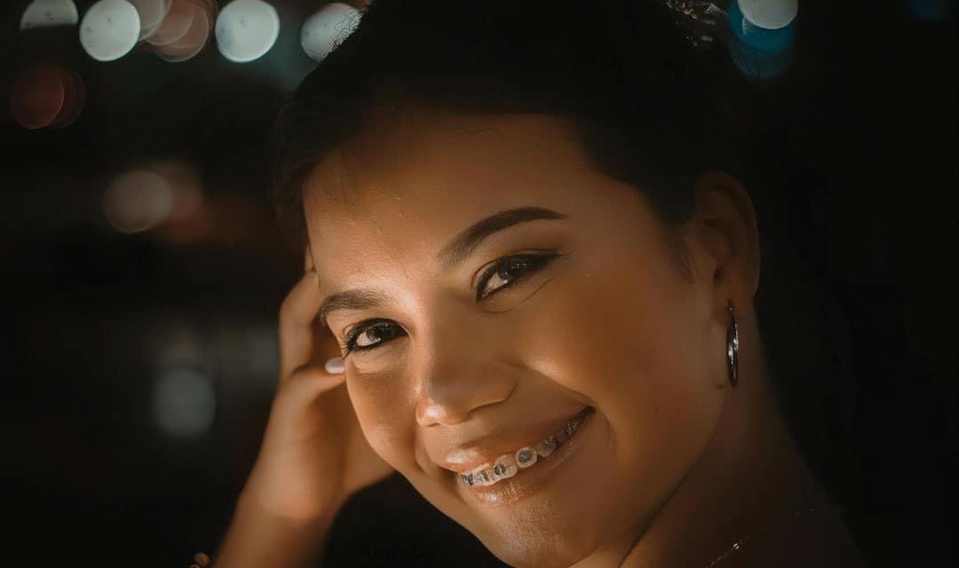 Person with braces smiling